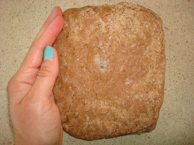 Hand Holding Graham Cracker Dough