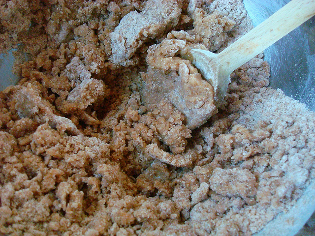 Wooden Spoon Mixing Sugar and Flour