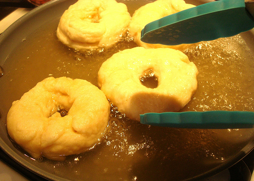 Frying Rings of Dough in Pan