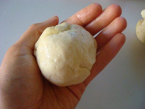 Hand Holding a Ball of Dough