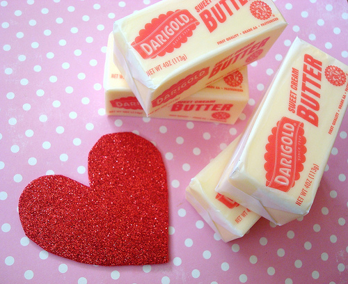 Stacks of Butter Next to Cut Out Heart