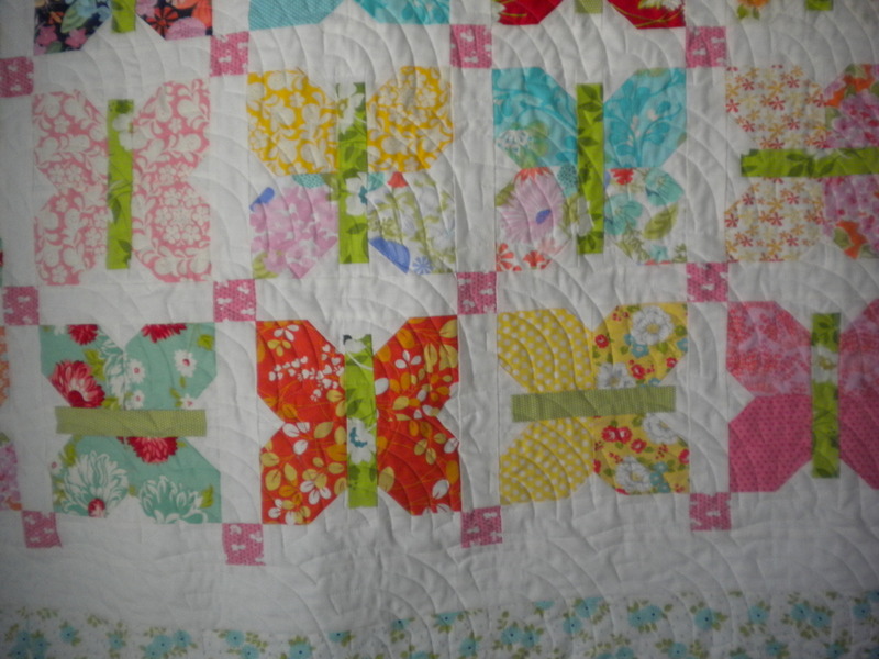 White Quilt with Colorful Patterned Butterflies