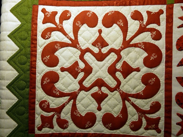 Quilt with Vibrant Design in Red and Green 