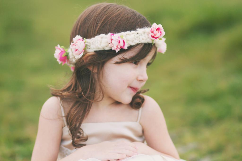 Little Girl Wearing Knit Headband with Flowers