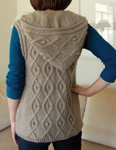 Woman Modeling Hooded Sleeveless Sweater