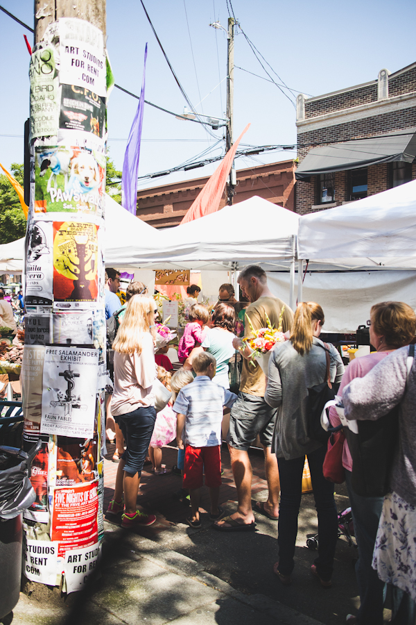 Tents and Crowd with People at Farmers Market