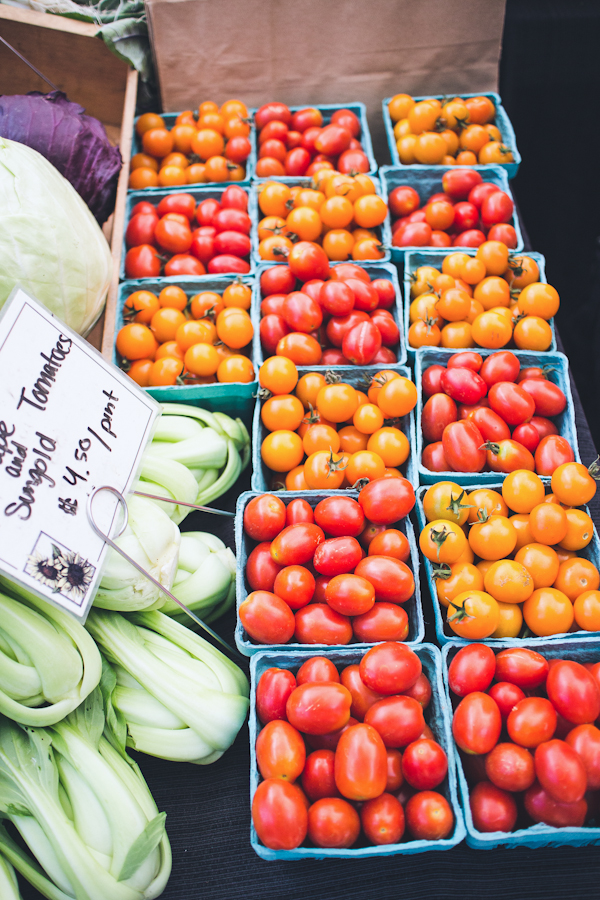 Blue Baskets of Filled with Red and Orange Cherry Tomatoes