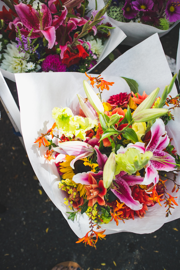 Bouquets of Flowers Wrapped in White Paper 