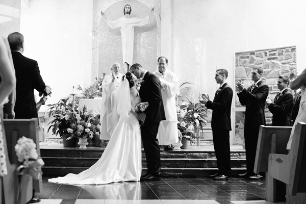 Black and White Photo of Wedding Couple at Alter