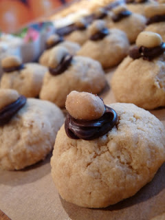 Rows of Peanut Butter Cookies Topped with Chocolate and Peanuts