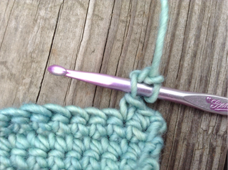 Closeup on Crochet Needle Passing Through Stitch 