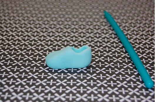 Close Up of Shoe-Shaped Fondant with Further Definition Next to Stick