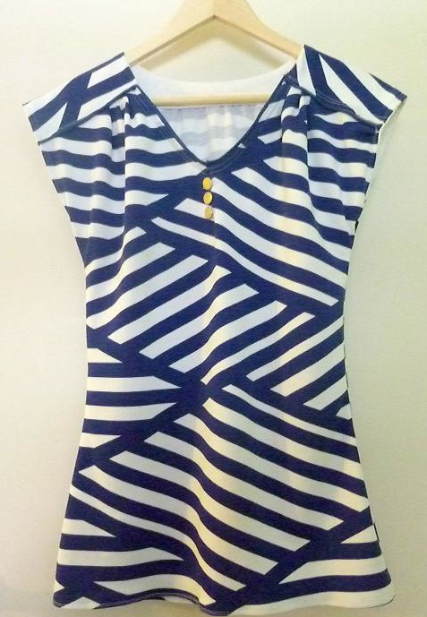 Nautical Blouse with Interweaving Stripes Hanging on Hanger