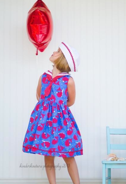 Little Girl in Sailor Dress Looking at Balloon 