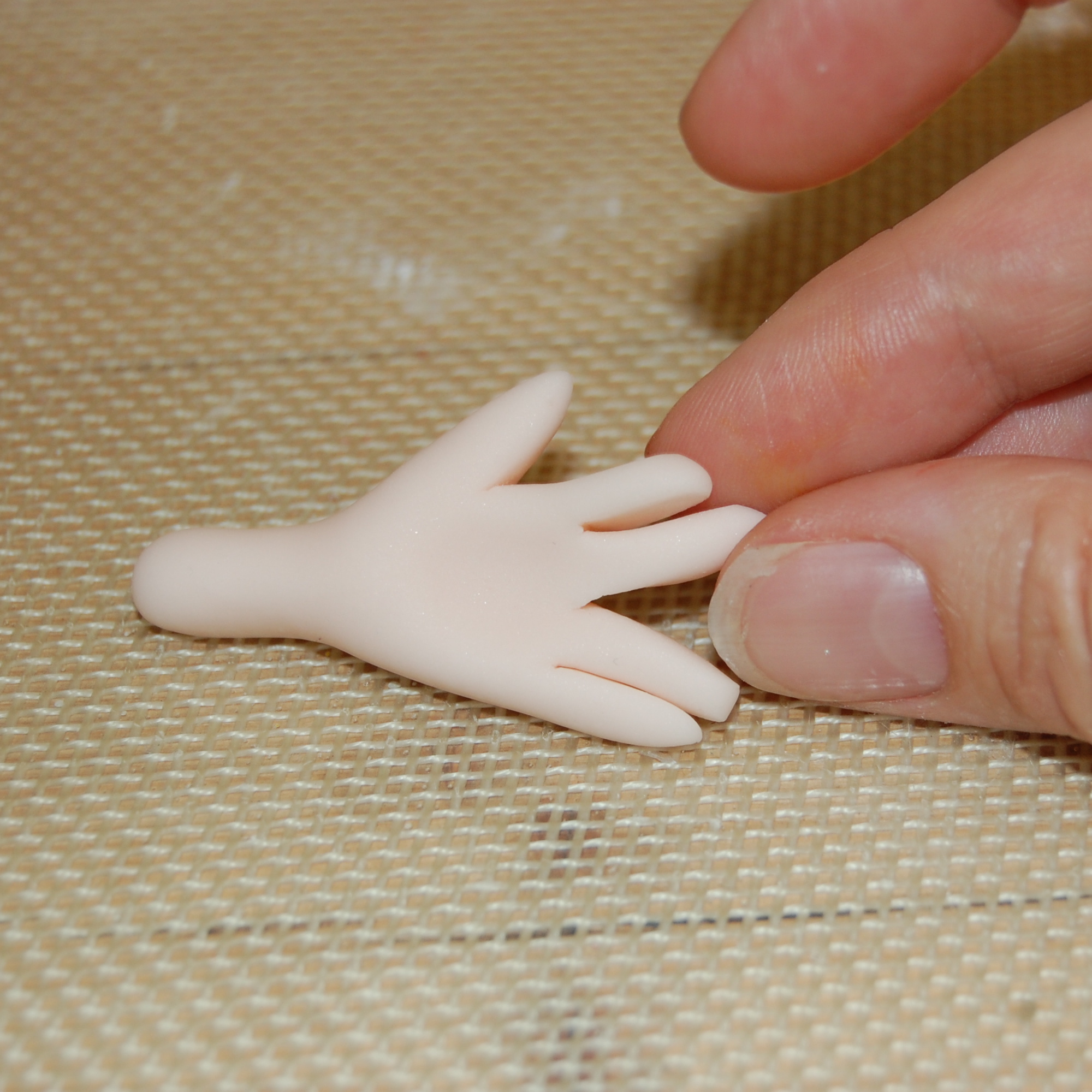 Close Up on Decorator's Fingers Molding Fondant Fingers