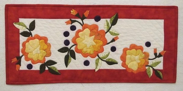 Quilt with Three Orange Flowers, Leaves and Buds