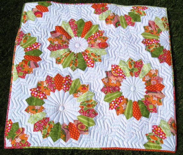 White Quilt with Colorful Flower Patterns