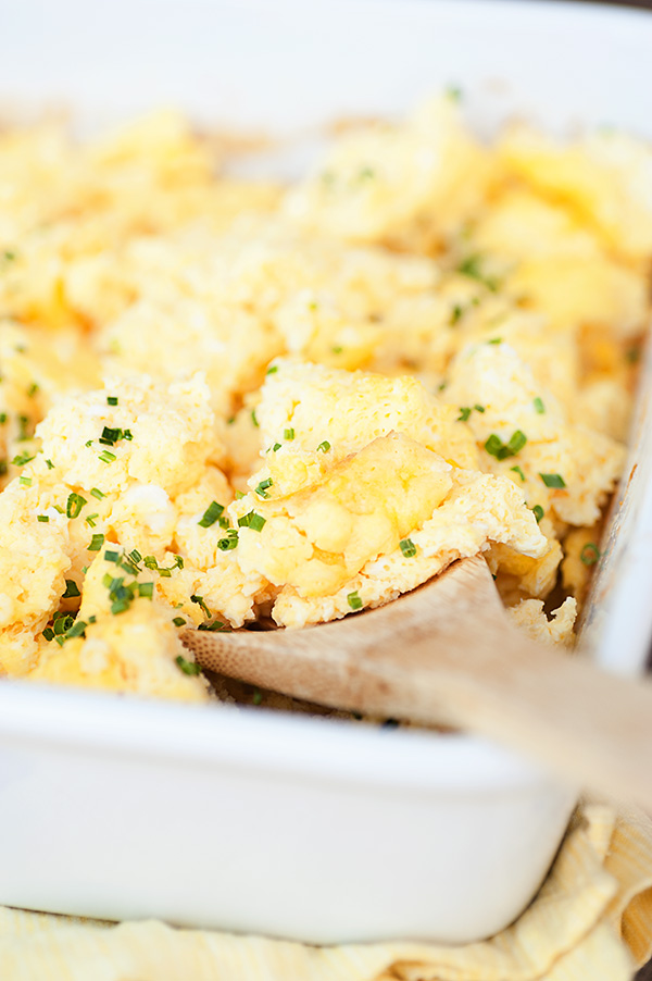 Close Up View of Scrambled Eggs and Wooden Spoon