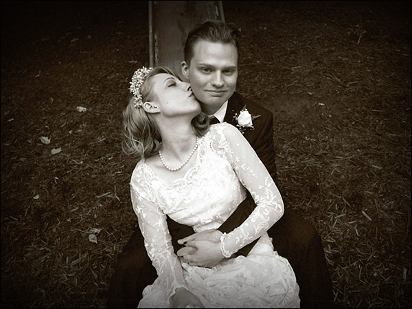 Black and White Photo of Bride Kissing Groom