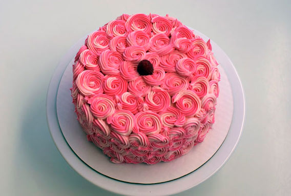 Top of Cake Covered in Pink Rosettes