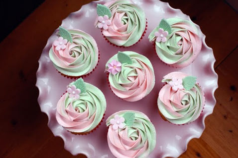 Green and Pink Rosette Iced Cupcakes on Plate