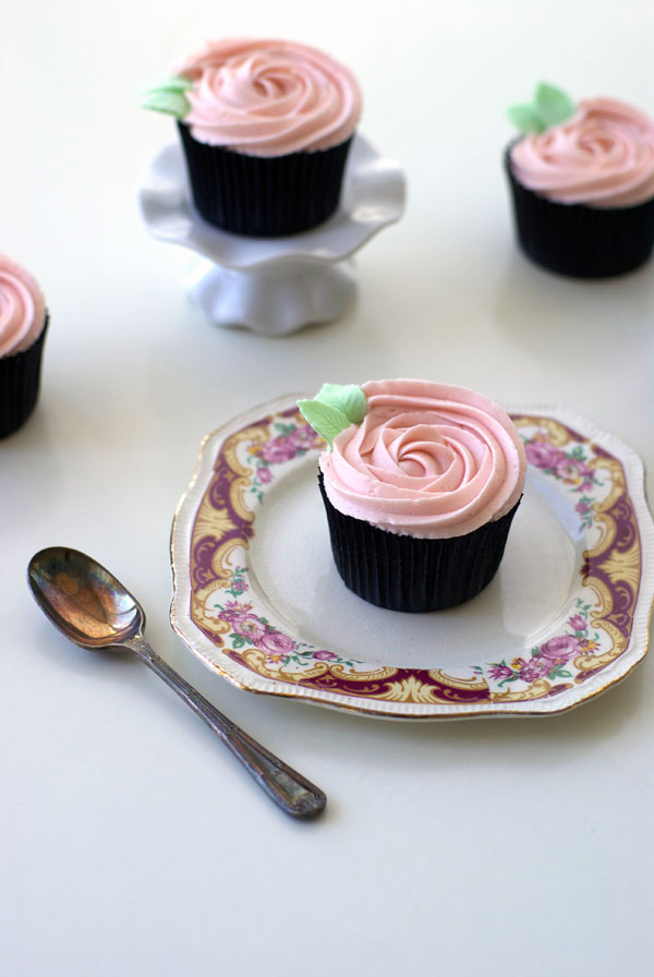 Pink Iced Cupcakes, One on Stand, One on Plate with Spoon