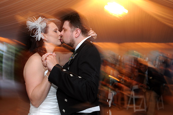 Bride and Groom Kissing on Dance Floor