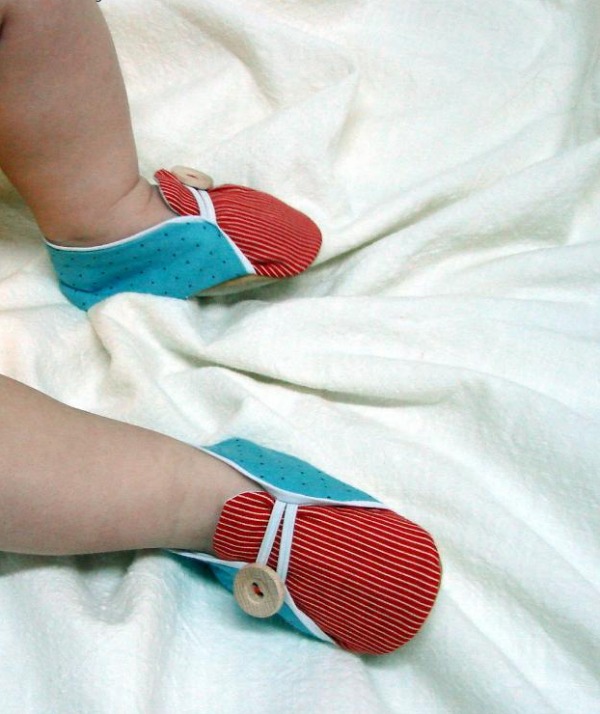 Baby Feet Wearing Little Blue and Red Sailor Shoes