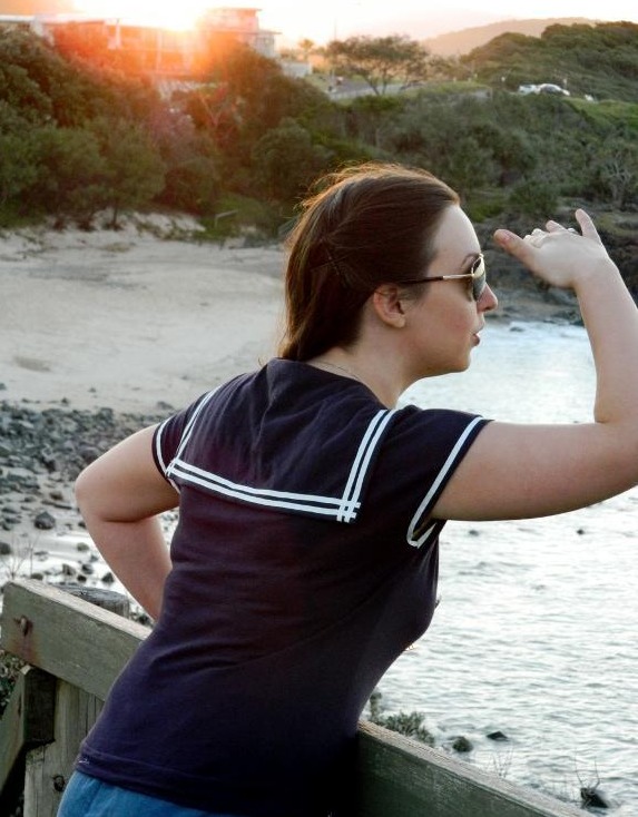 Woman Wearing Nautical Sailor Top, Leaning Over Balcony 