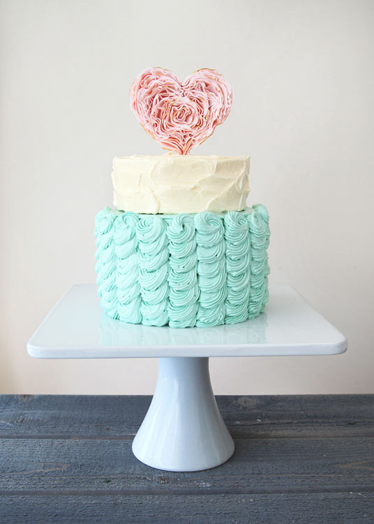 Two-Tiered Pastel Colored Cake with Heart Topper