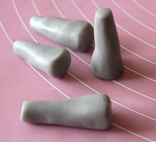 Grey Modeling Chocolate Formed intoLegs