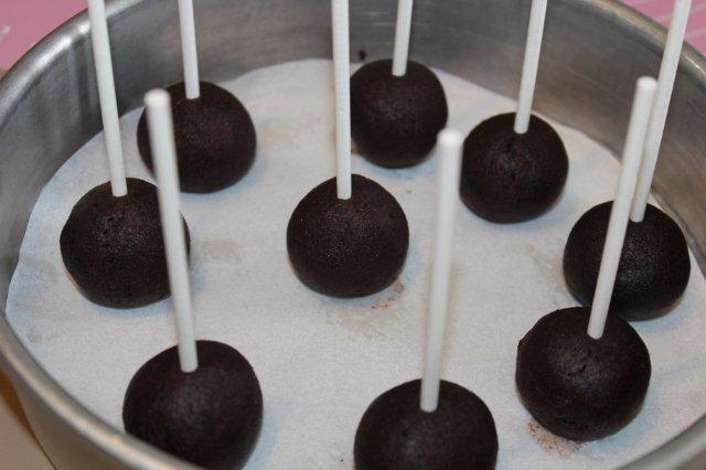 Cake Dough Balls in Pan with Sucker Sticks in Them