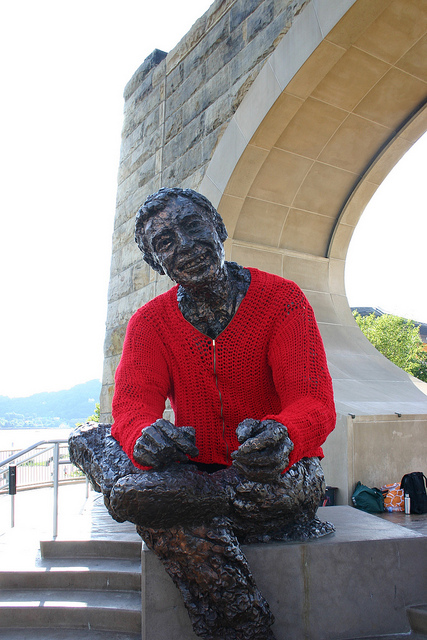 Statue of Smiling Man in a Red Sweater