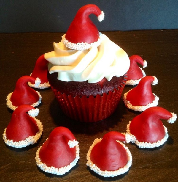 Modeling Chocolate Santa Hats on Cupcake and Surrounding Cupcake
