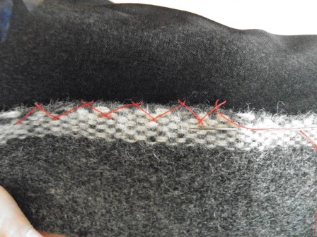 Grey Fabric with Hand Stitches: Catch Stitch