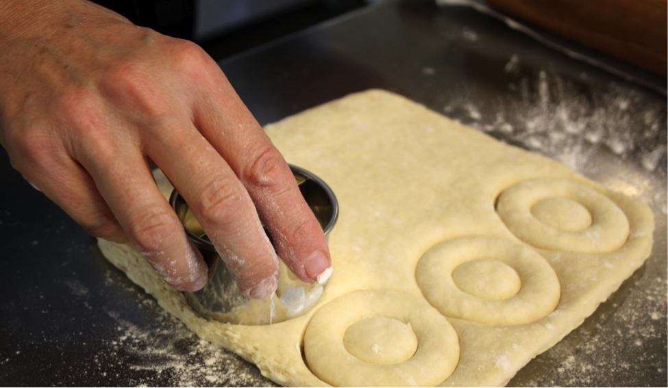 Woman Cutting Circles into Dough