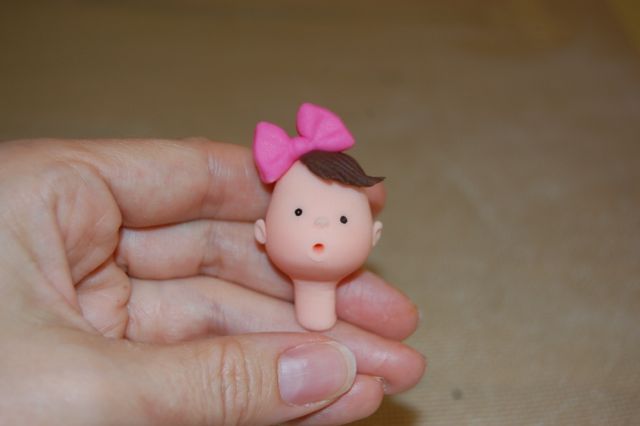 Baby Head with Fondant Hair and Fondant Bow