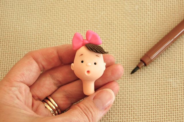 Fondant Baby Head with Little Drawn Eyebrows