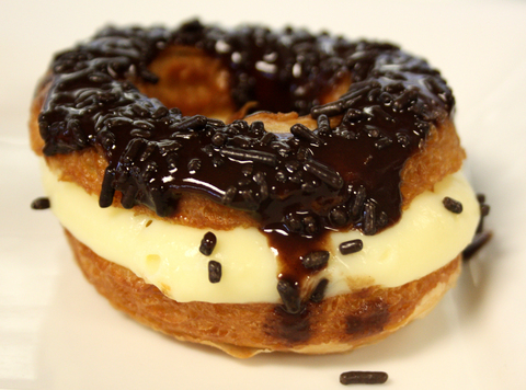 Cronut Filled with Cream, Topped with Chocolate and Sprinkles