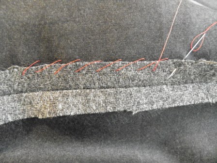 Grey Fabric with Hand Stitches: Overcast Stitch