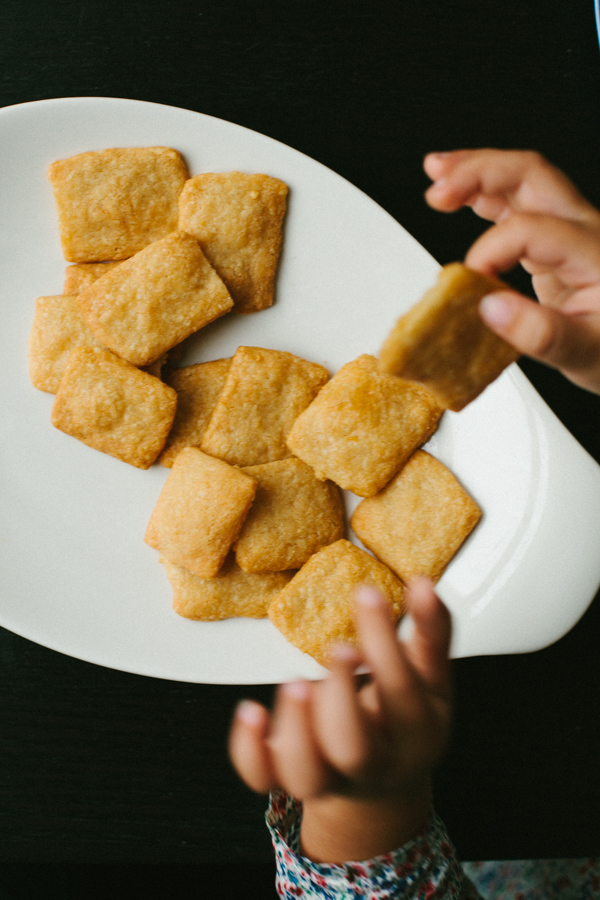 Kids Hands Snagging Crackers off Plate