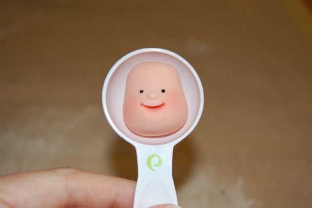 Fondant Face Held in Tablespoon