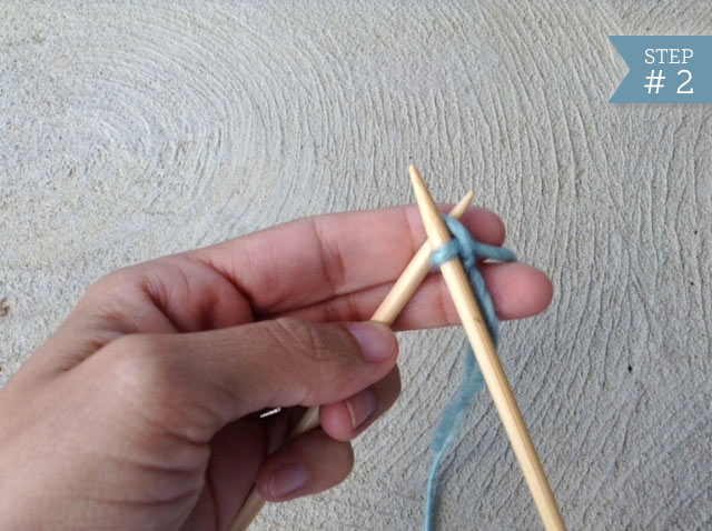 Hand Running Second Knitting Needle Through the Slip Knot 