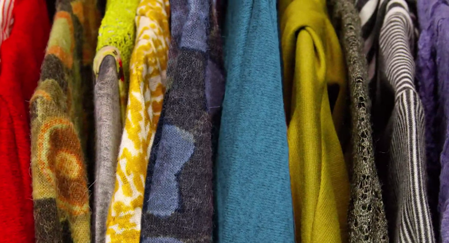 Colorful Coats Hanging in a Closet