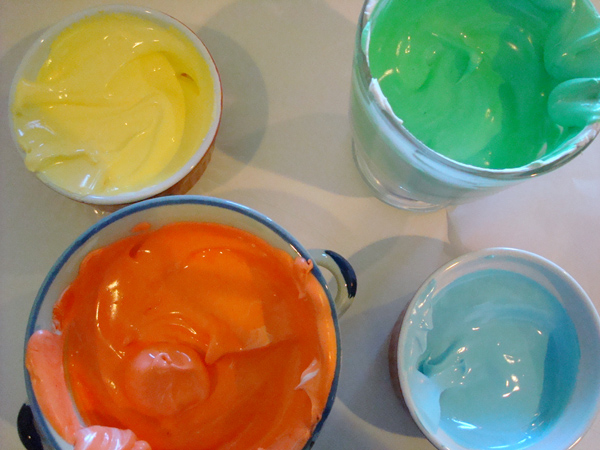 Glasses and Cups of Vividly-Colored Icing