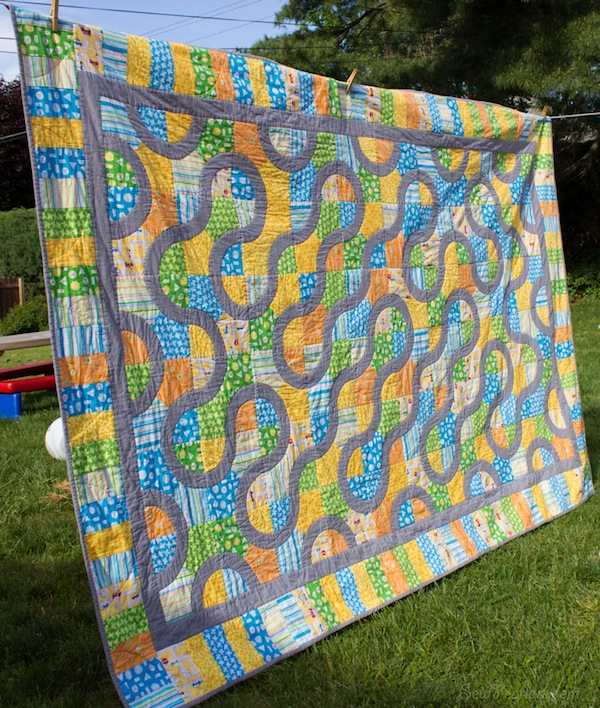 Quilt with Curve Design Hanging on Clothesline