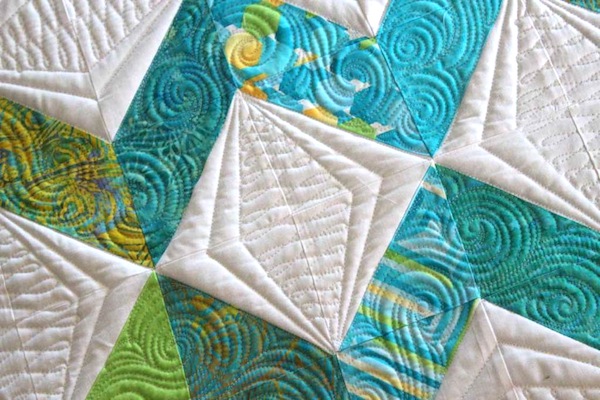 White Quilt with Teal Zigzag Design