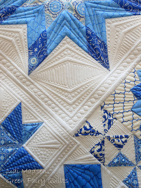 White Quilt with Blue Patterned Stars 