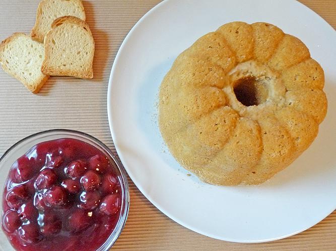 Rusk Pudding on Plate, Beside a Bowl of Cherries