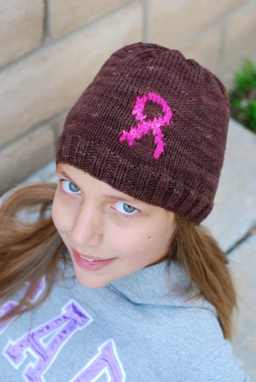 Girl Wearing Brown Hat with Breast Cancer Ribbon